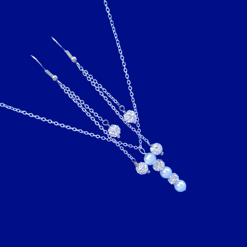 handmade pearl and crystal drop necklace accompanied by a pair of multi-strand drop earrings