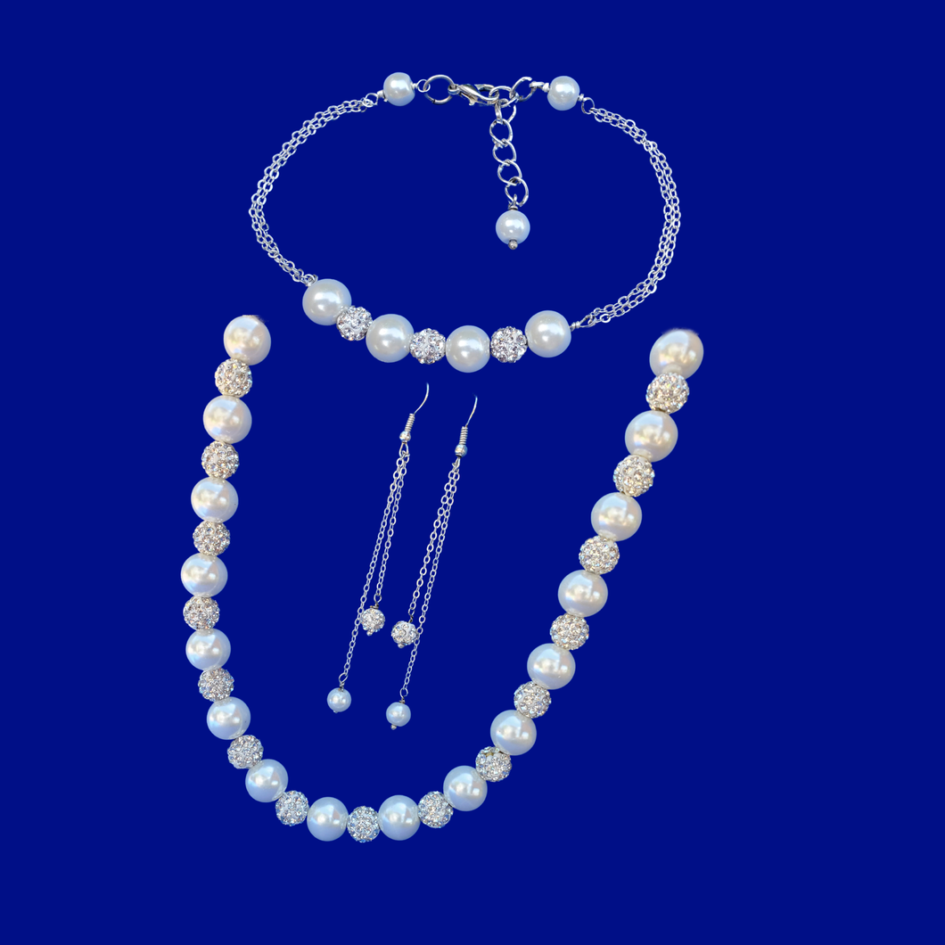 handmade pearl and crystal necklace accompanied by a bar bracelet and a pair of multi-strand drop earrings