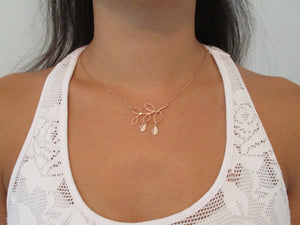 A handmade monogram Rose Gold Family Tree Leaf Charm Necklace.