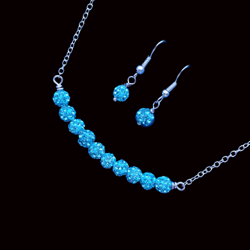 handmade crystal bar necklace accompanied by a pair of earrings