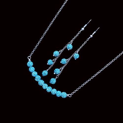 handmade pave crystal bar necklace accompanied by a pair of drop earrings