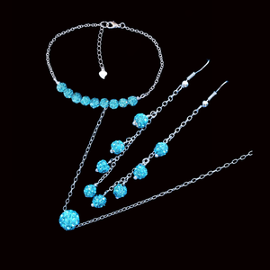 handmade floating crystal necklace accompanied by a bar bracelet and a pair of drop earrings