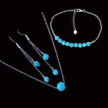 Load image into Gallery viewer, handmade floating crystal necklace accompanied by a bar bracelet and a pair of multi-strand drop earrings, aquamarine blue or custom color