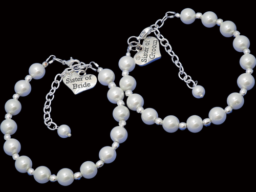A set of 2 handmade silver accented pearl charm bracelets for the sisters of the bride and groom