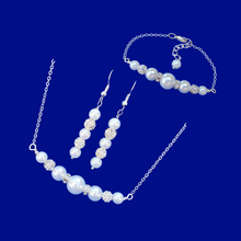 Load image into Gallery viewer, handmade pearl and crystal bar necklace accompanied by a matching bar bracelet and a pair of drop earrings