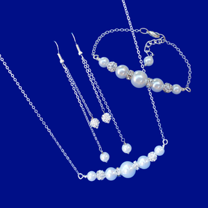 handmade pearl and crystal bar necklace accompanied by a matching bracelet and a pair of multi-strand drop earrings