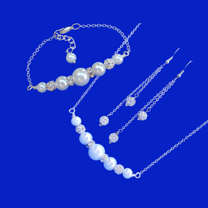 A handmade pearl and crystal bar necklace and bracelet gift set accompanied by a pair of crystal multi-strand drop earrings.