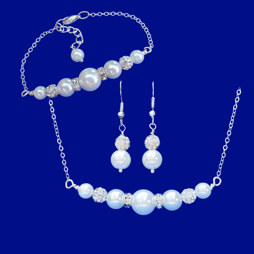 handmade pearl and crystal bar necklace accompanied by a matching bracelet and a pair of drop earrings