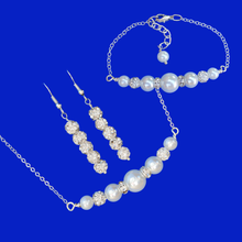 Load image into Gallery viewer, handmade pearl and crystal bar necklace accompanied by a matching bracelet and a pair of crystal drop earrings