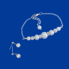 Load image into Gallery viewer, handmade pearl and crystal bar bracelet accompanied by a pair of pearl stud earrings