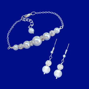 handmade pearl and crystal bar bracelet accompanied by a pair of drop earrings