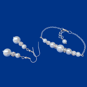 handmade pearl and crystal bar bracelet accompanied by a pair of drop earrings