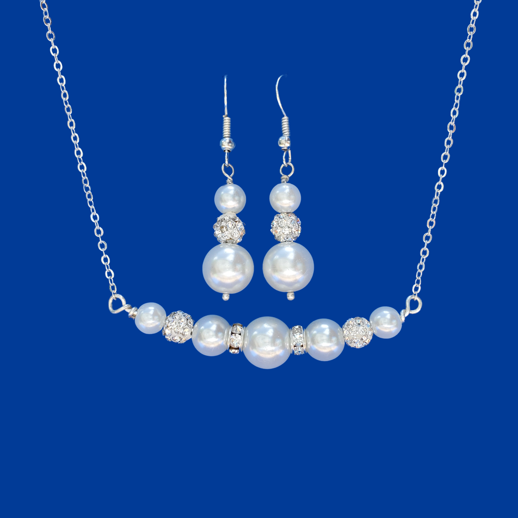handmade pearl and crystal bar necklace accompanied by a pair of drop earrings