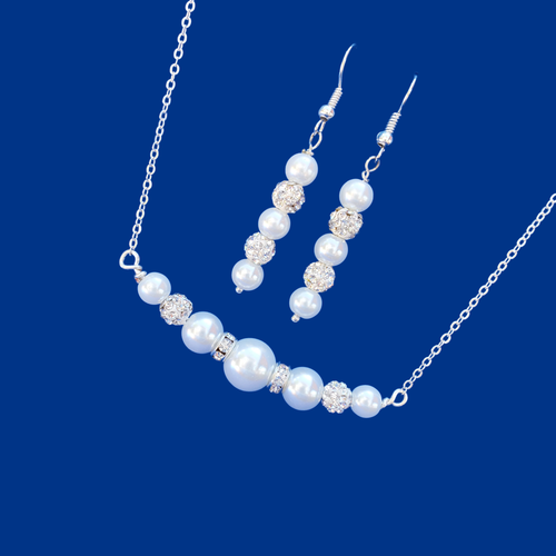 handmade pearl and crystal bar necklace accompanied by a pair of drop earrings