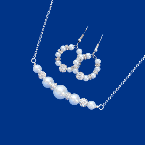 handmade pearl and crystal bar necklace accompanied by a pair of hoop earrings