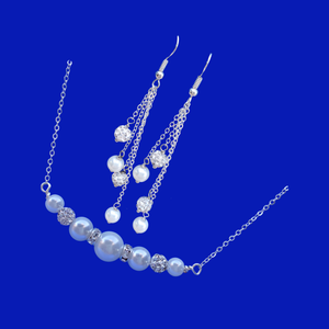 handmade pearl and crystal bar necklace accompanied by a pair of multi-strand drop earrings