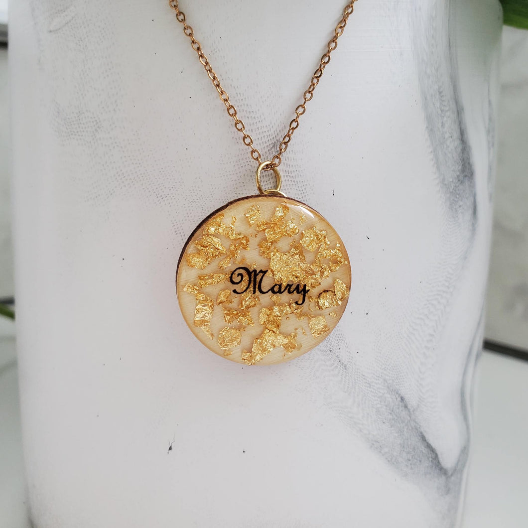 A handmade drop pendant made of a natural wood chip and gold leaf preserved in resin. Products Name Pendant - Necklaces - Drop Necklace