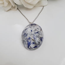 Load image into Gallery viewer, Pendant Necklace - Necklaces - Flower Necklace - Handmade resin oval necklace with real blue status flowers and silver flakes.