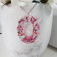 Load image into Gallery viewer, Handmade real flower oval pendant necklace made with red clover flowers and silver flakes. - Pendant Necklace, Flower Necklace, Necklaces