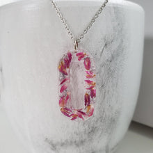 Load image into Gallery viewer, Handmade real flower rectangular pendant necklace made with red clover flowers and silver flakes. Flower Necklace, Rectangular Necklace, Necklaces