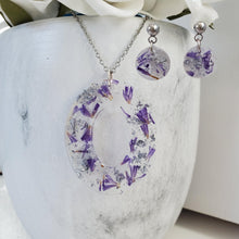 Load image into Gallery viewer, Handmade real flower oval drop pendant necklace accompanied by a by of dangling stud earrings made with purple statice and silver flakes preserved in resin. - Flower Jewelry, Bridesmaid Gifts, Jewelry Sets