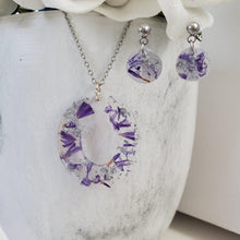 Load image into Gallery viewer, Handmade real flower oval drop pendant necklace accompanied by a pair of dangling stud circular earrings made with purple statice and silver flakes preserved in resin. - Jewelry Sets, Flower Jewelry, Bridesmaid Gifts
