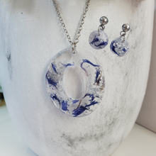 Load image into Gallery viewer, Handmade real flower oval drop pendant necklace accompanied by a pair of dangling stud circular earrings made with blue cornflower and silver flakes preserved in resin. - Jewelry Sets, Flower Jewelry, Bridesmaid Gifts
