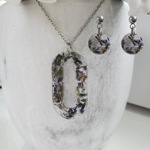 Load image into Gallery viewer, Handmade real flower oval pendant necklace accompanied by a pair of circular stud earrings made with lavender petals and silver flakes. Jewelry Sets, Flower Jewelry, Necklace Set