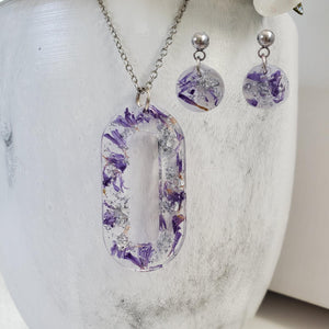 Handmade real flower oval pendant necklace accompanied by a pair of circular stud earrings made with purple statice and silver flakes. Jewelry Sets, Flower Jewelry, Necklace Set