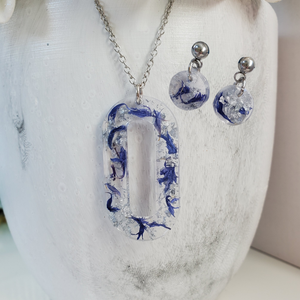 Handmade real flower oval pendant necklace accompanied by a pair of circular stud earrings made with blue cornflower and silver flakes. Jewelry Sets, Flower Jewelry, Necklace Set