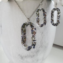 Load image into Gallery viewer, Handmade real flower oval pendant necklace accompanied by a matching pair of dangling stud earrings made with lavender petals and silver flakes preserved in resin. - Jewelry Sets, Resin Flower Jewelry, Necklace Set