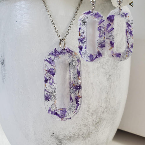Handmade real flower oval pendant necklace accompanied by a matching pair of dangling stud earrings made with purple statice and silver flakes preserved in resin. - Jewelry Sets, Resin Flower Jewelry, Necklace Set