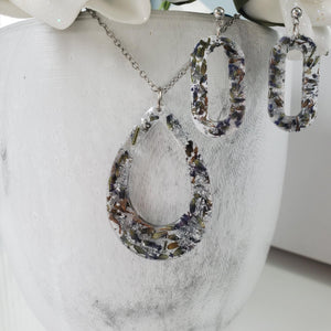 Handmade real flower teardrop pendant necklace accompanied by a pair of oval stud earrings made with lavender petals and silver flakes preserved in resin. Necklace And Earring Set, Resin Flower Jewelry