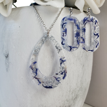 Load image into Gallery viewer, Handmade real flower teardrop pendant necklace accompanied by a pair of oval stud earrings made with blue cornflower and silver flakes preserved in resin. Necklace And Earring Set, Resin Flower Jewelry