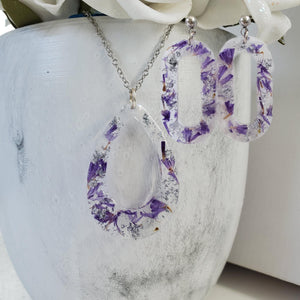 Handmade real flower teardrop pendant necklace accompanied by a pair of oval stud earrings made with purple statice and silver flakes preserved in resin. Necklace And Earring Set, Resin Flower Jewelry