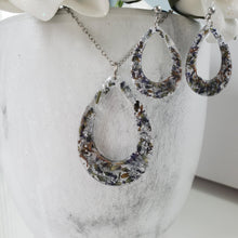 Load image into Gallery viewer, Handmade real flower teardrop pendant necklace accompanied by a matching pair of stud drop earrings made with lavender petals and silver flakes preserved in resin. Resin Jewelry, Flower Jewelry, Jewelry Sets