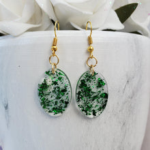 Load image into Gallery viewer, Oval Earrings, Drop Earrings, Resin Earrings, Earrings - Handmade resin oval drop earrings with green flakes.