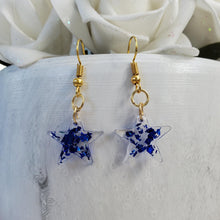 Load image into Gallery viewer, Star Earrings, Star Dangle Earrings, Earrings - handmade resin star drop earrings with blue flakes
