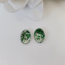 Load image into Gallery viewer, Oval Earrings, Stud Earrings, Resin Earrings, Earrings - Handmade resin oval stud earrings made with green flakes.