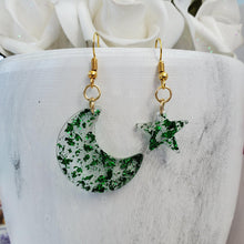Load image into Gallery viewer, Moon And Star Dangle Earrings, Drop Earrings, Earrings - Handmade resin crescent moon and star drop earrings with green flakes