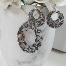 Load image into Gallery viewer, Handmade real flower oval pendant necklace accompanied by a pair of circular stud earrings made with lavender petals and silver leaf preserved in resin. - Pressed Flower Jewelry, Flower Jewelry, Jewelry Sets