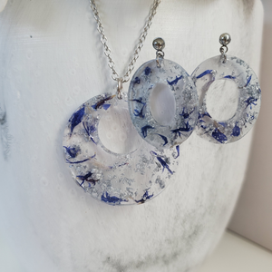 Handmade real flower circular pendant necklace accompanied by a pair of oval stud drop earrings made with blue cornflower and silver flakes preserved in resin. - Flower Jewelry, Red Jewelry, Jewelry Sets