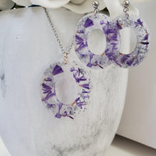 Load image into Gallery viewer, Handmade real flower oval pendant necklace accompanied by a matching pair of dangling stud earrings made with purple statice and silver flakes preserved in resin. - Flower Jewelry, Pink Jewelry, Jewelry Sets