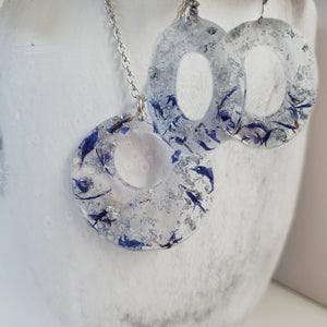 Handmade real flower circular pendant necklace accompanied by a pair of oval stud drop earrings made with blue cornflower and silver flakes preserved in resin. - Flower Jewelry, Purple Jewelry, Jewelry Sets