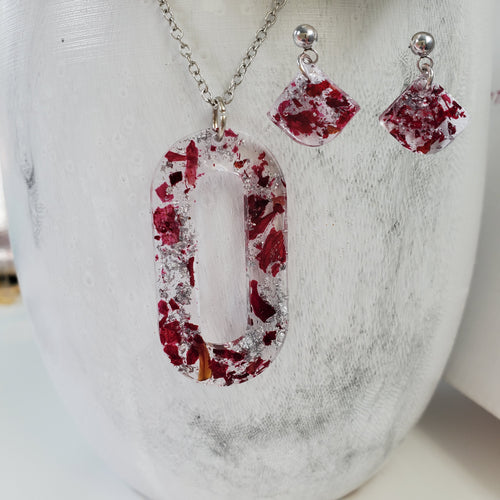 Handmade real flower oval pendant necklace accompanied by a matching pair of dangling stud earrings made with rose petals and silver flakes preserved in resin. - Red Jewelry, Jewelry Sets, Flower Jewelry