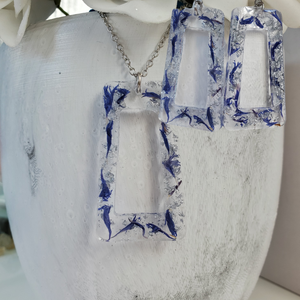 Handmade real flower rectangular pendant necklace accompanied by a matching pair of stud earrings made with blue cornflower and silver flakes. Blue Jewelry, Flower Jewelry, Jewelry Sets