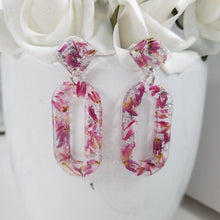 Load image into Gallery viewer, Handmade real flower oval drop post earrings made with red clover flowers and silver leaf preserved in resin. - Flower Earrings, Pink Earrings, Long Post Earrings