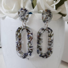 Load image into Gallery viewer, Handmade real flower long oval dangle earrings made with lavender petals and silver leaf preserved in resin. - Flower Earrings, Blue Earrings, Resin Jewelry