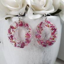 Load image into Gallery viewer, Handmade real flower oval post earrings made with red clover flowers and silver leaf preserved in resin. - Blue Earrings, Flower Earrings, Resin Flower Jewelry