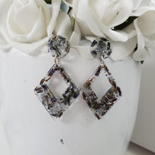 Load image into Gallery viewer, Handmade real flower rectangle long stud earrings made with lavender petals and silver leaf preserved in resin.